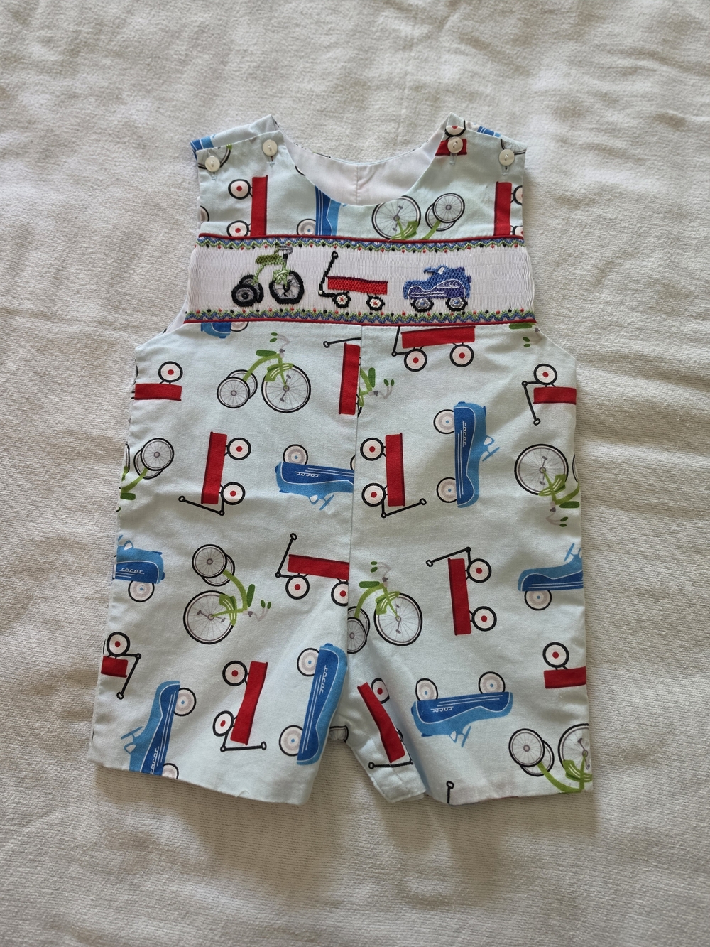Smocked Boys' Playtime Romper in Light Blue with Red & Green Accents